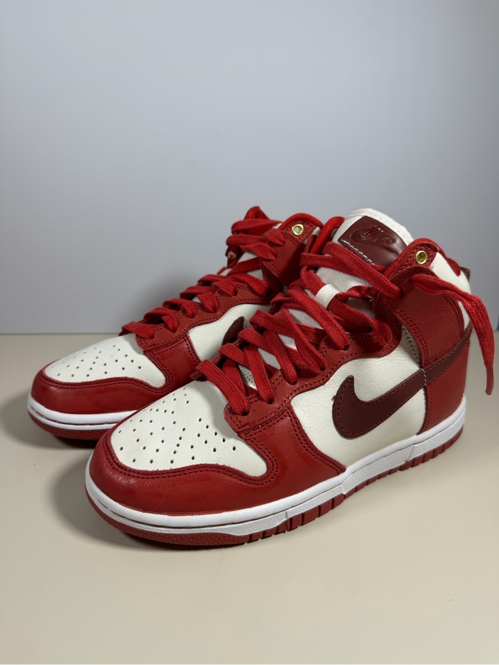 Nike Men’s Red and White High-Top Sneakers with Dark Red Swoosh